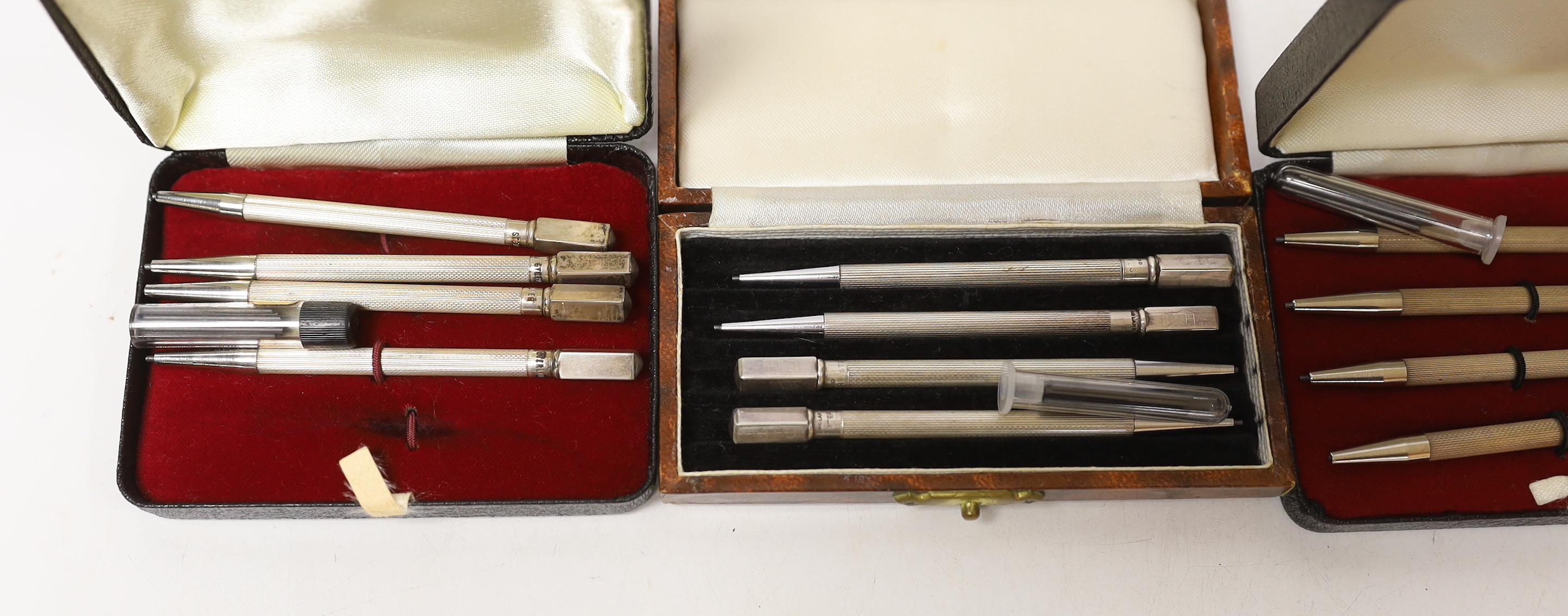 Three cased sets of sterling bridge pencils and a modern silver bookmark.
